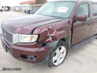 2014 Honda Ridgeline RTL with VIN 5FPYK1F52EB010700, listed as a IAAI auction lot 41490401 with 180,947 mi miles. Bid and sale history available at carsss.com. Image 6.
