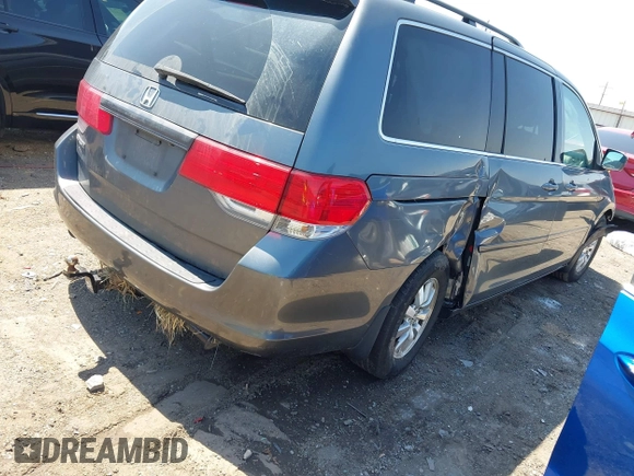 2010 Honda Odyssey EX-L with VIN 5FNRL3H7XAB061280, listed as a IAAI auction lot 41979790 with 245,386 mi miles. Bid and sale history available at carsss.com. Image 4.