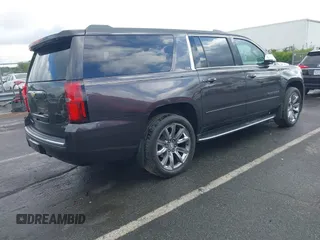 2015 Chevrolet Suburban LTZ with VIN 1GNSKKKC4FR589913, listed as a IAAI auction lot 42017190 with 216,145 mi miles. Bid and sale history available at carsss.com. Image 4.