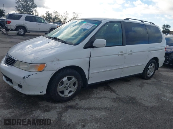 2000 Honda Odyssey EX z VIN 2HKRL1863YH589248, wystawiony jako IAAI lot #41735692 z przebiegiem 164 677 mil mil oraz . Historia ofert i sprzedaży dostępna na DreamBid. Obrazek 2.