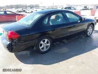 2003 Ford Taurus SE Standard with VIN 1FAFP53U23G219786, listed as a IAAI auction lot 41799874 with 172,128 mi miles. Bid and sale history available at carsss.com. Image 4.