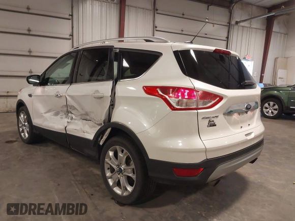 2016 Ford Escape Titanium with VIN 1FMCU9J99GUA61848, listed as a IAAI auction lot 42300324 with 51,692 mi miles and . Bid and sale history available at DreamBid. Image 3.