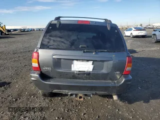 2003 Jeep Grand Cherokee Limited z VIN 1J8GW58N73C502929, wystawiony jako Copart lot #79472734 z przebiegiem 231 176 mil mil oraz Szkoda całkowita • Salvage title. Historia ofert i sprzedaży dostępna na DreamBid. Obrazek 6.