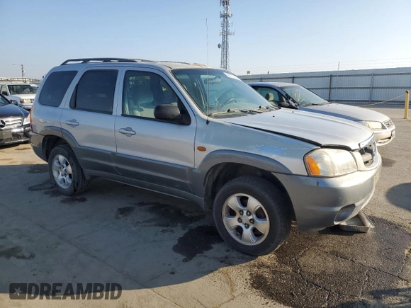 2002 Mazda Tribute LX with VIN 4F2YU09152KM50320, listed as a Copart auction lot 88131405 with 238,013 mi miles and Salvage Title. Bid and sale history available at carsss.com. Image 4.