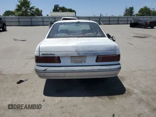1989 Ford Taurus GL z VIN 1FABP52UXKG244224, wystawiony jako Copart lot #59239225 z przebiegiem 30 853 mil mil oraz Czysty tytuł • Clean title. Historia ofert i sprzedaży dostępna na DreamBid. Obrazek 6.