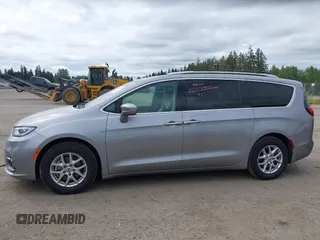 2021 Chrysler Pacifica Touring L with VIN 2C4RC1BG3MR552828, listed as a IAAI auction lot 42207838 with 67,917 mi miles and . Bid and sale history available at DreamBid. Image 14.