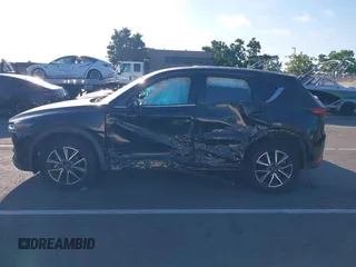 2018 Mazda CX-5 Grand Touring with VIN JM3KFBDM1J0345014, listed as a IAAI auction lot 42703926 with 151,453 mi miles and . Bid and sale history available at DreamBid. Image 14.