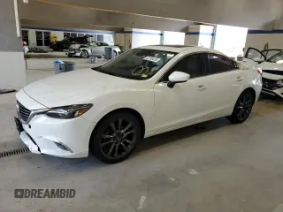 2016 Mazda 6 i Grand Touring с VIN JM1GJ1W51G1455013, выставлен на аукционе Copart как лот 63255415 с пробегом 94 122 миль миль и Списание • Salvage title. История ставок и продаж доступна на DreamBid. Изображение 1.