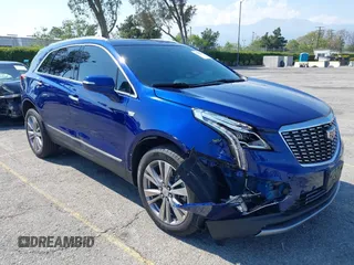 2023 Cadillac XT5 FWD Premium Luxury z VIN 1GYKNCRS3PZ176654, wystawiony jako IAAI lot #42136259 z przebiegiem 20 403 mil mil oraz . Historia ofert i sprzedaży dostępna na DreamBid. Obrazek 1.