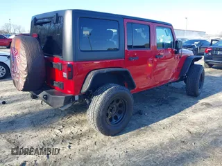 2014 Jeep Wrangler Unlimited Sport with VIN 1C4BJWDG2EL126480, listed as a IAAI auction lot 41479323 with 93,192 mi miles. Bid and sale history available at carsss.com. Image 4.