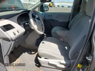 2012 Toyota Sienna with VIN 5TDZK3DC8CS198495, listed as a Copart auction lot 57335205 with 66,786 mi miles and Salvage title. Bid and sale history available at DreamBid. Image 7.