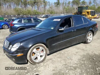 2003 Mercedes-Benz E-Class 5.0L with VIN WDBUF70J53A199951, listed as a Copart auction lot 51138595 with 129,414 mi miles and Salvage Title. Bid and sale history available at carsss.com. Image 1.
