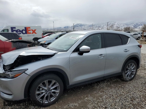 2021 Mazda CX-5 Grand Touring with VIN JM3KFBDM1M1403699, listed as a Copart auction lot 49888655 with 29,919 mi miles and Salvage Title. Bid and sale history available at carsss.com. Image 1.