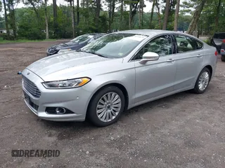 2013 Ford Fusion SE Hybrid z VIN 3FA6P0LU1DR291060, wystawiony jako IAAI lot #42731674 z przebiegiem 93 918 mil mil oraz . Historia ofert i sprzedaży dostępna na DreamBid. Obrazek 2.