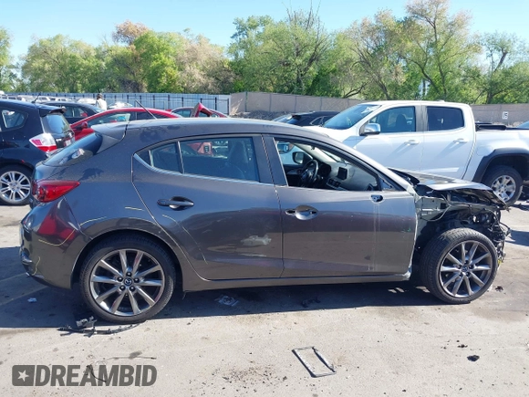 2018 Mazda 3 Touring with VIN 3MZBN1L34JM164952, listed as a IAAI auction lot 42179420 with 106,706 mi miles and . Bid and sale history available at DreamBid. Image 13.