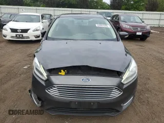 2017 Ford Focus Titanium z VIN 1FADP3N29HL240527, wystawiony jako Copart lot #62891695 z przebiegiem 126 926 mil mil oraz Szkoda całkowita • Salvage title. Historia ofert i sprzedaży dostępna na DreamBid. Obrazek 5.