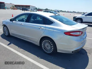 2014 Ford Fusion Titanium with VIN 3FA6P0K96ER248025, listed as a IAAI auction lot 42189061 with 64,351 mi miles and . Bid and sale history available at DreamBid. Image 3.