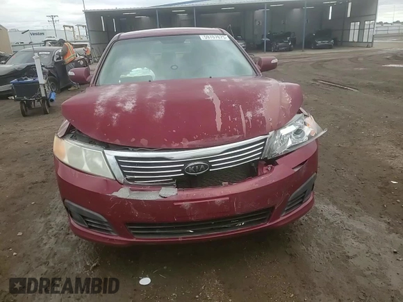2009 Kia Optima LX z VIN KNAGE228395313765, wystawiony jako Copart lot #59707675 z przebiegiem 170 773 mil mil oraz Szkoda całkowita • Salvage title. Historia ofert i sprzedaży dostępna na DreamBid. Obrazek 13.