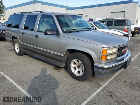 1999 GMC Suburban with VIN 3GKEC16R0XG526194, listed as a Copart auction lot 83740634 with 199,583 mi miles and Clean title. Bid and sale history available at DreamBid. Image 4.