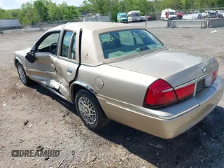 2000 Mercury Grand Marquis GS z VIN 2MEFM74W3YX610461, wystawiony jako IAAI lot #42162767 z przebiegiem 181 400 mil mil oraz . Historia ofert i sprzedaży dostępna na DreamBid. Obrazek 3.