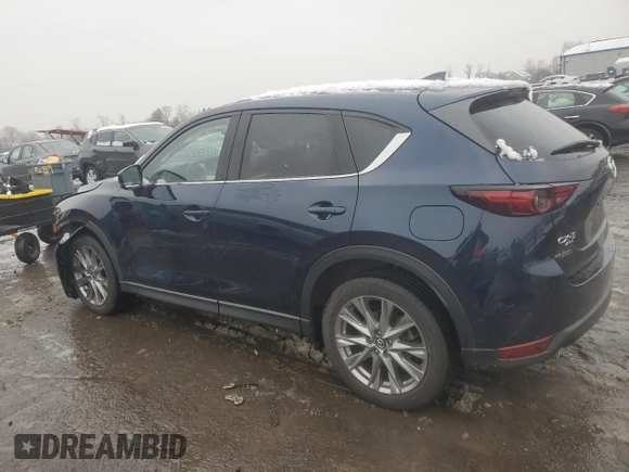 2021 Mazda CX-5 Grand Touring with VIN JM3KFBDM0M0391325, listed as a Copart auction lot 44863215 with 21,997 mi miles and Salvage Title. Bid and sale history available at DreamBid. Image 2.