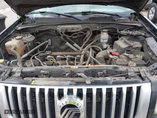 2011 Mercury Mariner with VIN 4M2CN8B7XBKJ01717, listed as a IAAI auction lot 42030587 with 115,766 mi miles. Bid and sale history available at carsss.com. Image 10.