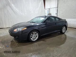 2008 Hyundai Tiburon GS z VIN KMHHM66D48U265282, wystawiony jako Copart lot #77391204 z przebiegiem 77 088 mil mil oraz Szkoda całkowita • Salvage title. Historia ofert i sprzedaży dostępna na DreamBid. Obrazek 1.