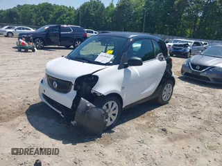2016 Smart fortwo Passion z VIN WMEFJ5DA6GK078340, wystawiony jako IAAI lot #42140363 z przebiegiem 114 647 mil mil oraz . Historia ofert i sprzedaży dostępna na DreamBid. Obrazek 6.