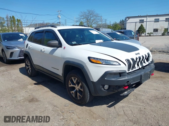 2014 Jeep Cherokee Trailhawk with VIN 1C4PJMBS8EW163212, listed as a IAAI auction lot 42124107 with 114,999 mi miles. Bid and sale history available at carsss.com. Image 1.
