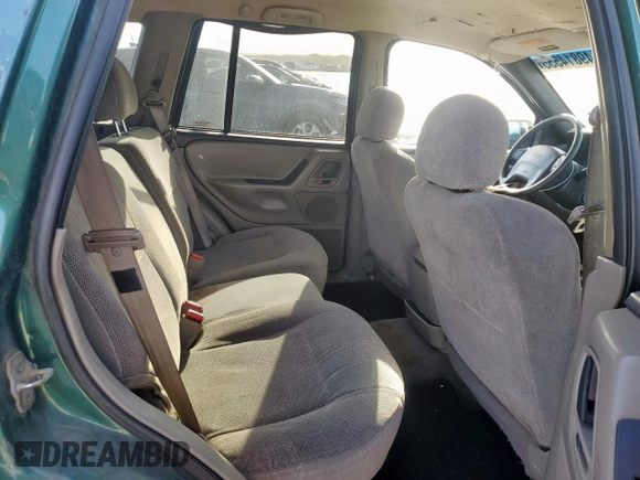 1999 Jeep Grand Cherokee Laredo with VIN 1J4G258S0XC561054, listed as a Copart auction lot 49814555 with Not provided miles and Salvage title. Bid and sale history available at DreamBid. Image 11.