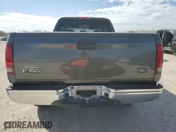 2003 Ford F-150 XL with VIN 1FTRX17L33NB34789, listed as a Copart auction lot 73762304 with 0 mi miles and Salvage Title. Bid and sale history available at carsss.com. Image 6.
