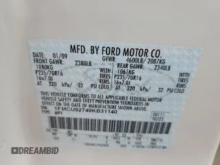 2009 Ford Escape XLS with VIN 1FMCU92749KB31140, listed as a Copart auction lot 53645705 with 213,481 mi miles and Salvage title. Bid and sale history available at DreamBid. Image 13.