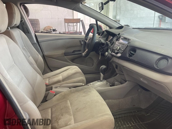 2010 Honda Insight LX with VIN JHMZE2H59AS032860, listed as a Copart auction lot 60861945 with 253,444 mi miles and Clean title. Bid and sale history available at DreamBid. Image 5.