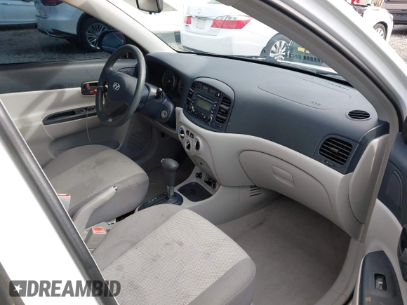 2006 Hyundai Accent GLS with VIN KMHCN46C36U009036, listed as a IAAI auction lot 41705369 with 134,328 mi miles. Bid and sale history available at carsss.com. Image 5.