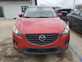 2016 Mazda CX-5 Grand Touring with VIN JM3KE4DY5G0660201, listed as a Copart auction lot 52165205 with 108,231 mi miles and Salvage Title. Bid and sale history available at DreamBid. Image 5.