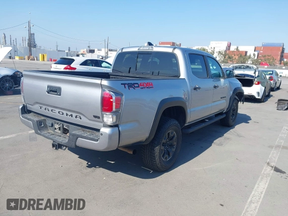 2021 Toyota Tacoma SR with VIN 5TFCZ5AN6MX270972, listed as a IAAI auction lot 42460823 with 76,062 mi miles and . Bid and sale history available at DreamBid. Image 4.