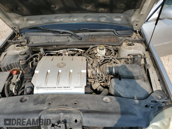 2004 Cadillac DeVille DTS z VIN 1G6KF57984U188454, wystawiony jako Copart lot #62397494 z przebiegiem 142 060 mil mil oraz Szkoda całkowita • Salvage title. Historia ofert i sprzedaży dostępna na DreamBid. Obrazek 12.
