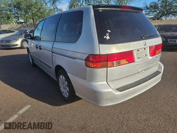 2001 Honda Odyssey LX with VIN 2HKRL18501H617598, listed as a Copart auction lot 65471805 with 125,298 mi miles and Clean title. Bid and sale history available at DreamBid. Image 2.
