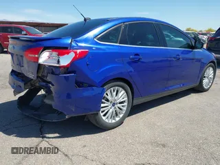 2015 Ford Focus Titanium with VIN 1FADP3J25FL314903, listed as a IAAI auction lot 42053132 with 125,418 mi miles and . Bid and sale history available at carsss.com. Image 4.