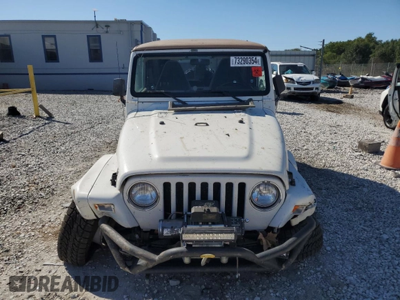 2000 Jeep Wrangler Sahara with VIN 1J4FA59SXYP764539, listed as a Copart auction lot 52707385 with 136,159 mi miles and Salvage title. Bid and sale history available at DreamBid. Image 5.