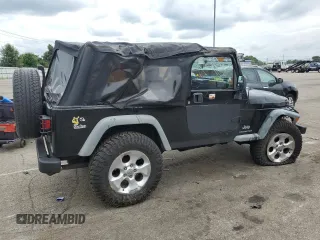 2005 Jeep Wrangler Unlimited with VIN 1J4FA44S75P358246, listed as a Copart auction lot 60958695 with 150,003 mi miles and Salvage title. Bid and sale history available at DreamBid. Image 3.