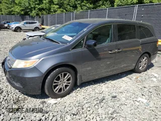 2012 Honda Odyssey EX-L with VIN 5FNRL5H69CB019771, listed as a Copart auction lot 59333624 with 197,203 mi miles and Salvage Title. Bid and sale history available at carsss.com. Image 1.