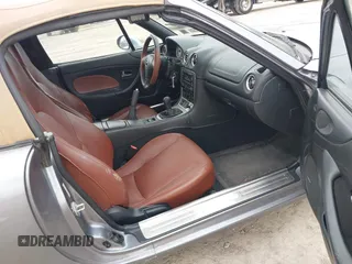 2002 Mazda MX-5 Miata Cloth z VIN JM1NB353X20227591, wystawiony jako IAAI lot #42066430 z przebiegiem 79 585 mil mil oraz . Historia ofert i sprzedaży dostępna na DreamBid. Obrazek 5.