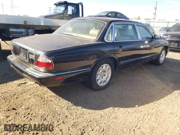 2001 Jaguar XJ with VIN SAJDA23C31LF28667, listed as a Copart auction lot 76983144 with 87,542 mi miles and Clean title. Bid and sale history available at DreamBid. Image 3.