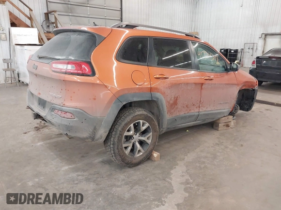 2015 Jeep Cherokee Trailhawk with VIN 1C4PJMBS5FW524462, listed as a IAAI auction lot 41774347 with 107,592 mi miles. Bid and sale history available at carsss.com. Image 4.