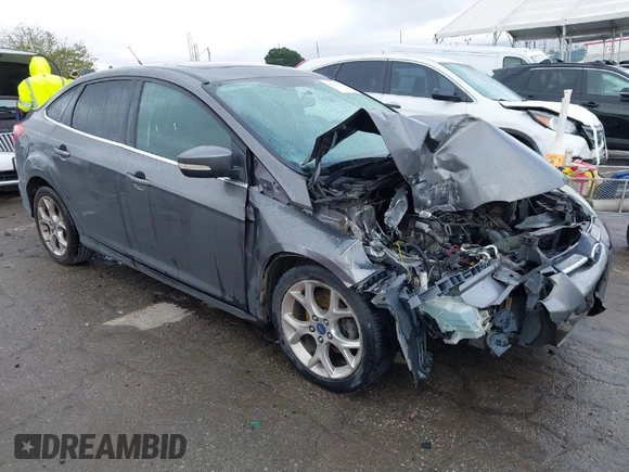 2013 Ford Focus Titanium with VIN 1FADP3J2XDL270393, listed as a IAAI auction lot 41814775 with 76,907 mi miles and . Bid and sale history available at carsss.com. Image 1.
