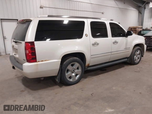 2010 Chevrolet Suburban LTZ with VIN 1GNUKKE31AR290571, listed as a IAAI auction lot 40948006 with 163,758 mi miles. Bid and sale history available at carsss.com. Image 4.