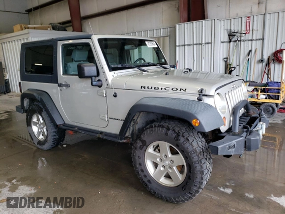 2007 Jeep Wrangler Rubicon z VIN 1J8GA64117L187431, wystawiony jako Copart lot #61293624 z przebiegiem 263 459 mil mil oraz Szkoda całkowita • Salvage title. Historia ofert i sprzedaży dostępna na DreamBid. Obrazek 4.