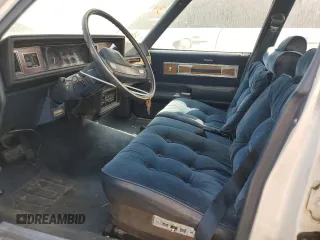 1987 Oldsmobile Cutlass z VIN 2G3GM51Y1H2347545, wystawiony jako Copart lot #76087594 z przebiegiem 98 257 mil mil oraz Szkody całkowita. Historia ofert i sprzedaży dostępna na DreamBid. Obrazek 7.
