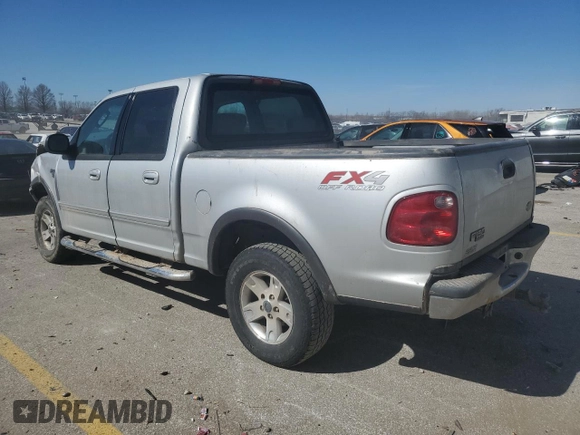 2003 Ford F-150 XLT with VIN 1FTRW08L03KD74119, listed as a Copart auction lot 47373105 with 303,513 mi miles and Salvage Title. Bid and sale history available at carsss.com. Image 2.